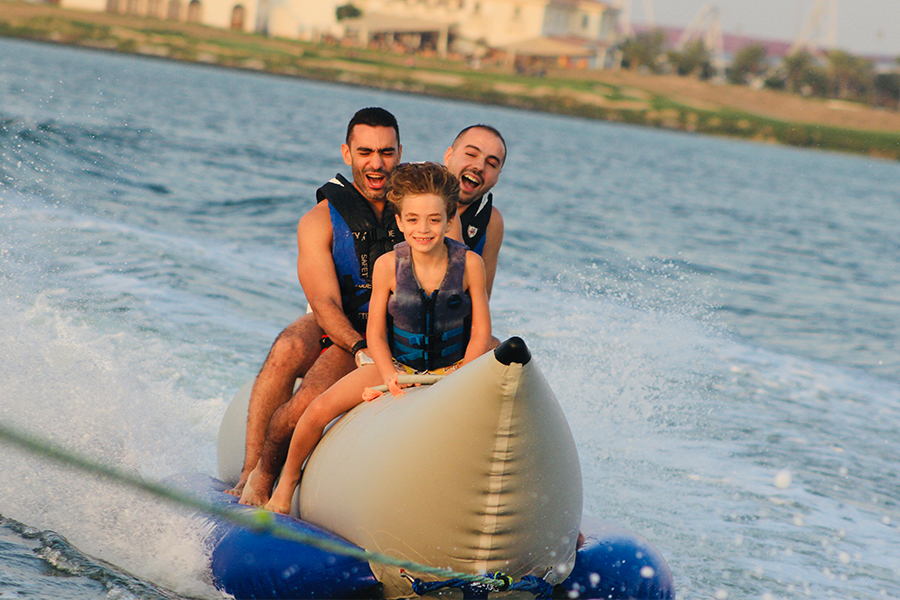 Friends and families enjoying different water adventures along the Dubai coastline