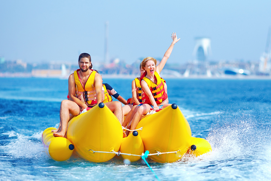 Friends and family enjoying memorable water adventures with fishing, jet skiing and banana boat rides in Dubai