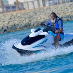 Jet ski rider exploring Dubai's coastline with safety gear and professional guidance
