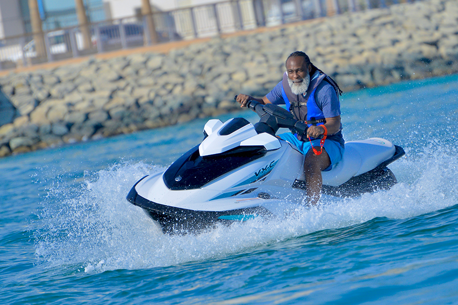 Jet ski rider exploring Dubai's coastline with safety gear and professional guidance